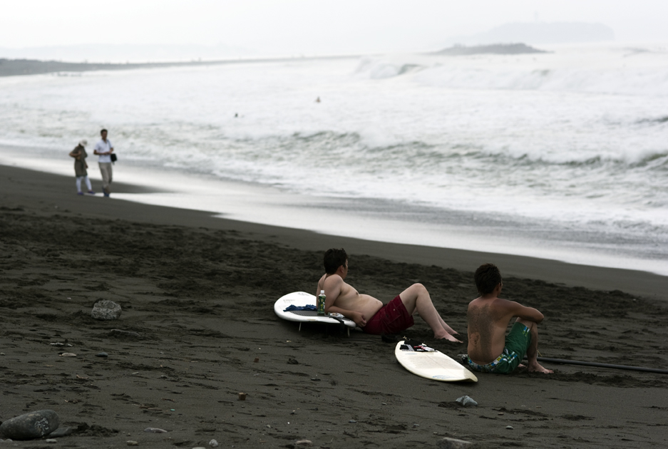 surfers on the beach in Tsujido